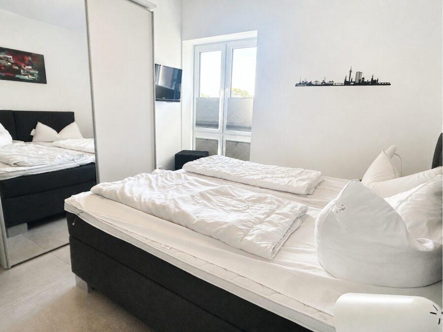 Ferienimmobilie mit seitlichem Meerblick und hervorragender Vermietung im Nordseebad Dangast - Schlafzimmer 2 (41227)