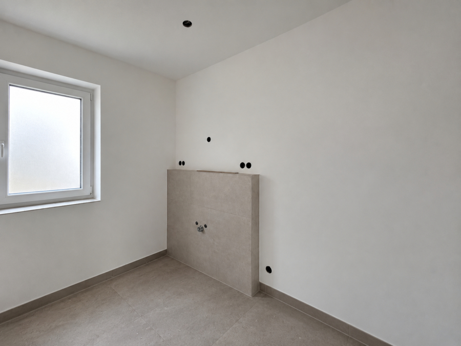 Neubau trifft Energieeffizienz: Moderne Doppelhaushälfte in Zetel - Badezimmer (48884)